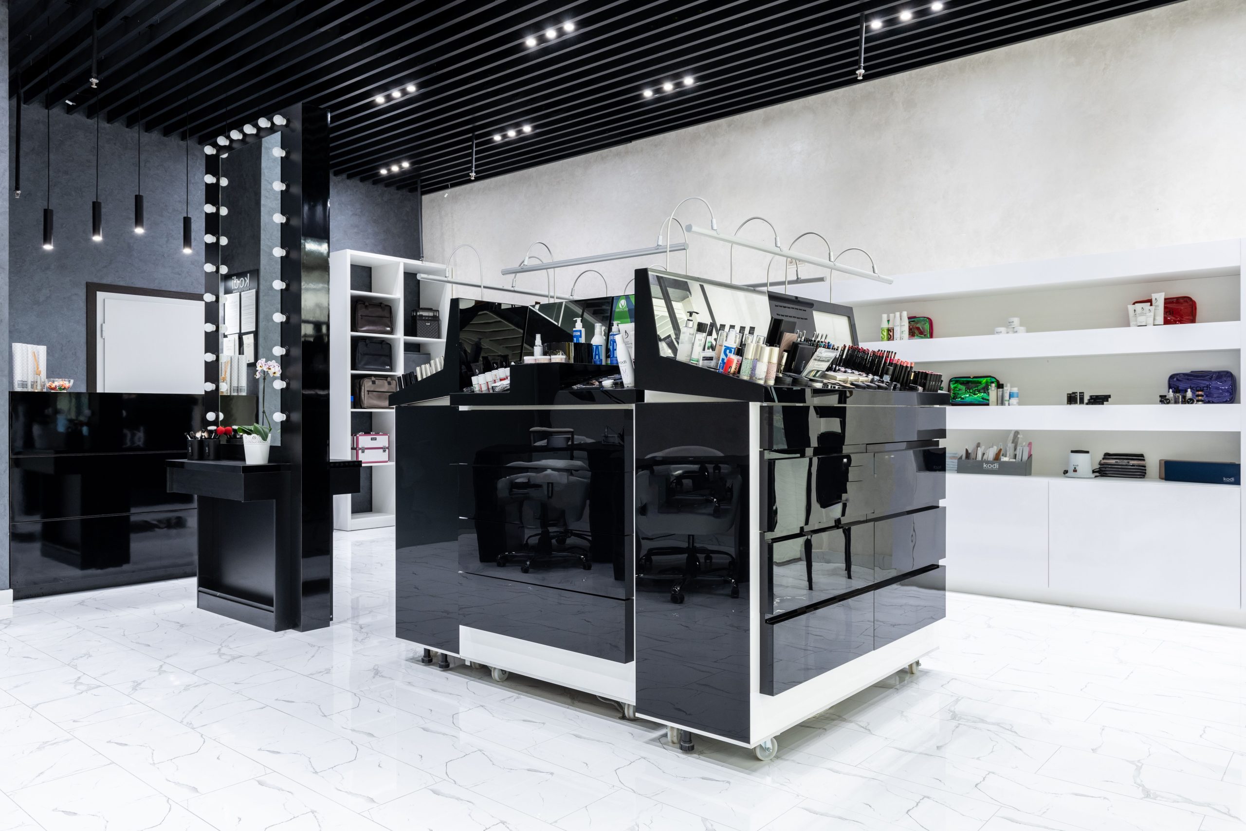 Modern cosmetic store with sleek display units and shelving, showcasing products in a stylish interior.